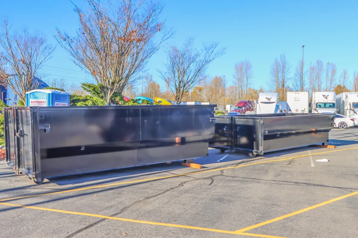 Professional dumpster rental service with roll-off container on residential driveway in Lebanon